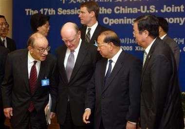 U.S. Federal Reserve Board Chairman Alan Greenspan, U.S. Treasury Secretary John Snow, Chinese Finance Minister Jin Renqing and People's Bank of China Governor Zhou Xiaochuan talk before the opening ceremony of the 17th session of the Sino-U.S. Joint Economic Committee meeting in Grand Epoch City in Xianghe, about 100 km east of Beijing, October 16, 2005.