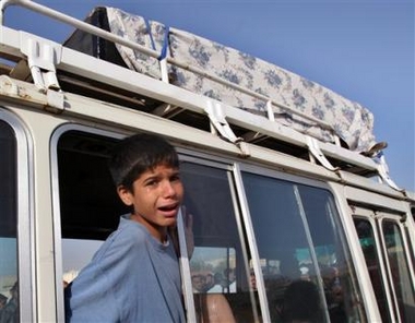 An Iraqi child cries during the funeral of six al-Mahdi army, a militia loyal to radical Shiite cleric Muqtada al-Sadr, members, in Baghdad, Iraq, Tuesday Oct. 18, 2005. The men were found dead Monday after disappearing 14 days ago, relatives said. 