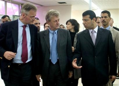 Palestinian Cabinet Minister Mohammed Dahlan, right, speaks with Mark Otte, center, the European Union envoy to the Middle East and another EU official during a tour of the Rafah border crossing in the southern Gaza Strip, Monday, Nov. 7, 2005. A European Union delegation toured the Gaza-Egypt border Monday as part of negotiations with Israel and the Palestinians on the role of European inspectors at the Rafah terminal. (AP