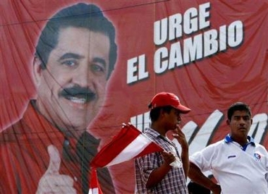 Supporters wait for a press conference of Liberal Party presidential candidate Manuel Zelaya, in Tegucigalpa, Honduras, Monday Nov. 28, 2005.