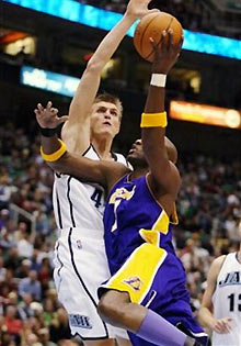 Utah Jazz forward Andrie Kirilenko of Russia, left, blocks a shot by Los Angeles Lakers guard William 'Smush' Parker, right, during the first half of their NBA basketball game Tuesday, January 3, 2006 in Salt Lake City.