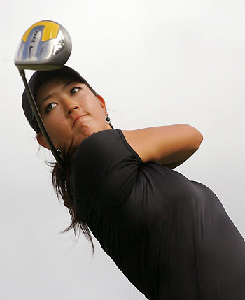 Michelle Wie of the U.S. tees off on the fifth hole at the Waialae Country Club during the second round of the Sony Open golf tournament in Honolulu, Hawaii January 13, 2006. [Reuters]