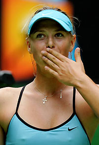 Russia's Maria Sharapova blows kisses to the crowd after winning her match against Germany's Sandra Kloesel at the Australian Open tennis tournament in Melbourne January 16, 2006. 