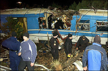 Montenegran policemen and rescuers search for injured passengers at the derailed train near Podgorica.