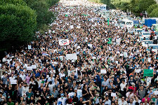 Hundreds of thousands stage somber rally in Iran