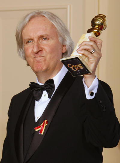 James Cameron poses with his award best motion picture for 