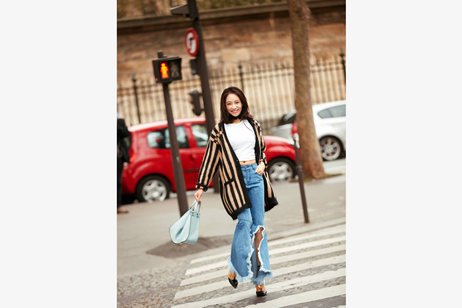 Song Qian poses for street style photos