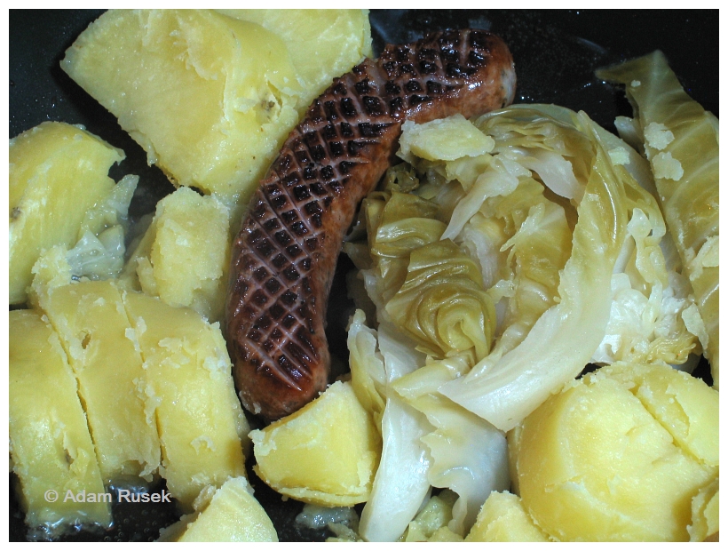 Fried Polish sausage with steamed potatoes and cabbage