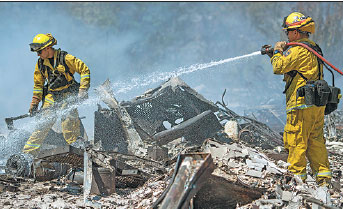 California wildfire drives over 80,000 from their homes