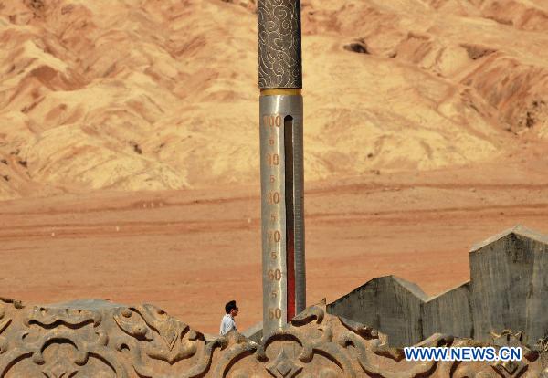 Tourists visit Flaming Mountain in Xinjiang