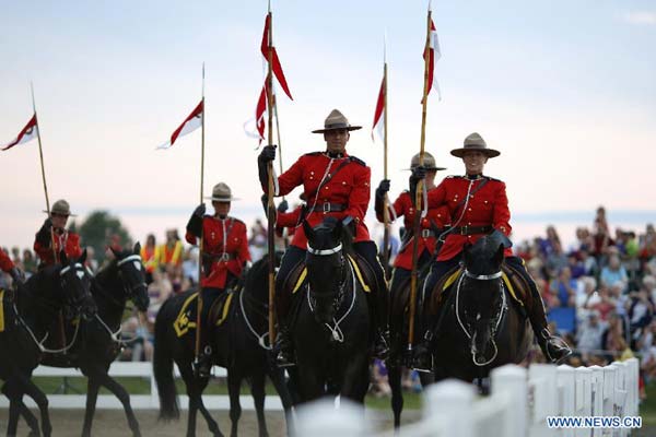 RCMP feast tourists with performances at Sunset Ceremonies in Canada