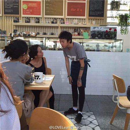 Leah Dou serves coffee in Beijing