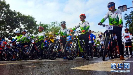 Mountain bikers race through lush landscape in Zhuanglang