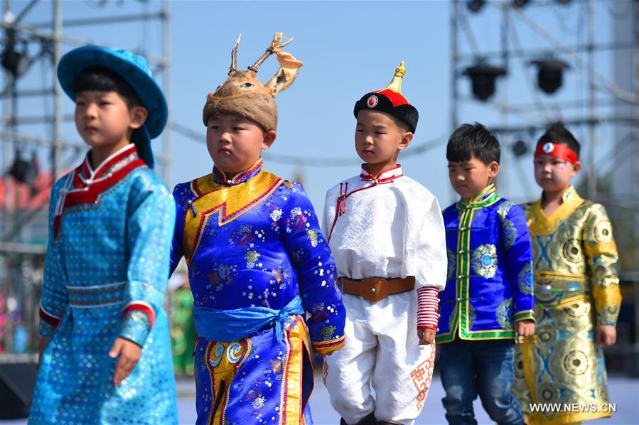 Models present costumes in China's Inner Mongolia