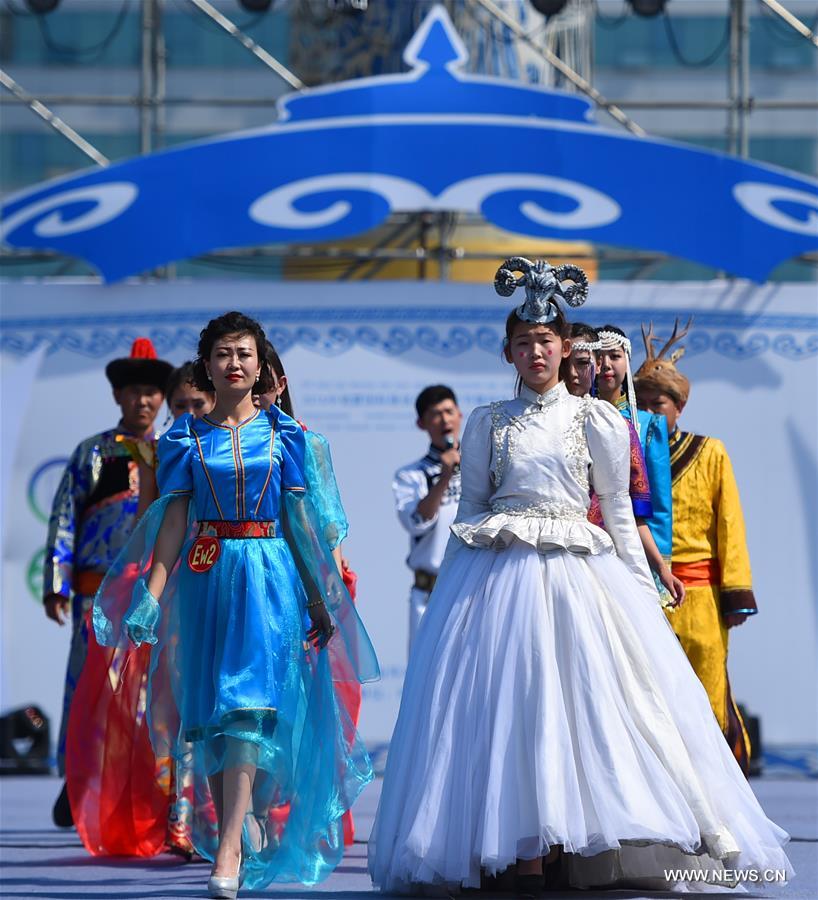 Models present costumes in China's Inner Mongolia