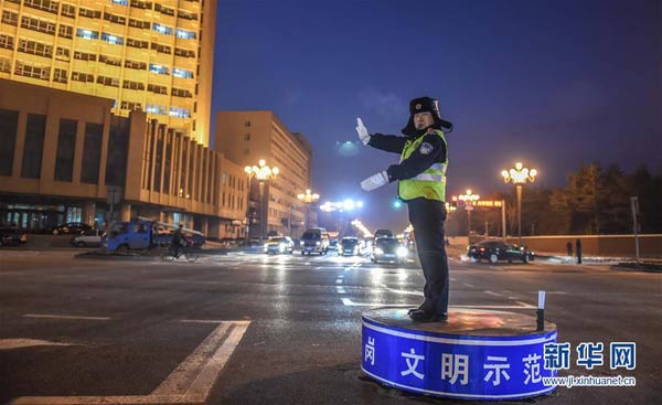 NE China police sticks to the job on a freezing cold day