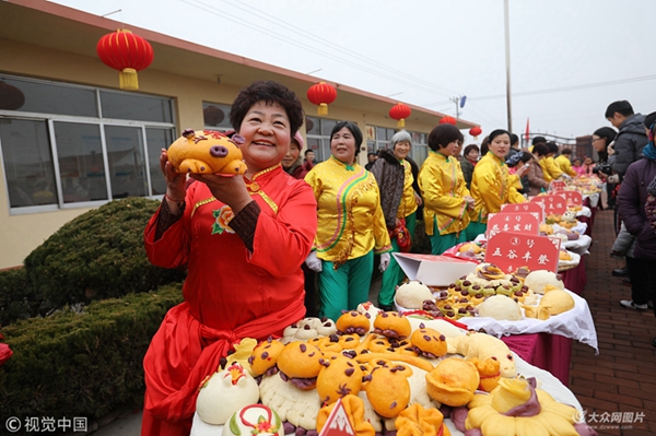 Steamed bun making competition held in Rizhao