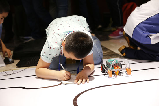 Children participate in robotic competition