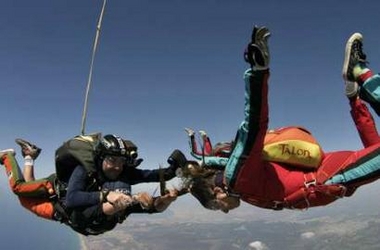 Cuts hair while skydiving