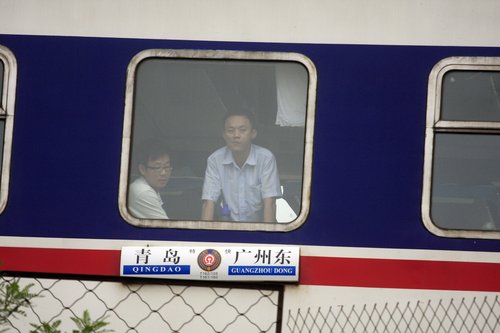 Moving passenger train catches fire in E. China