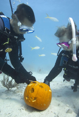 Carving Jack-o-Lanterns underwater