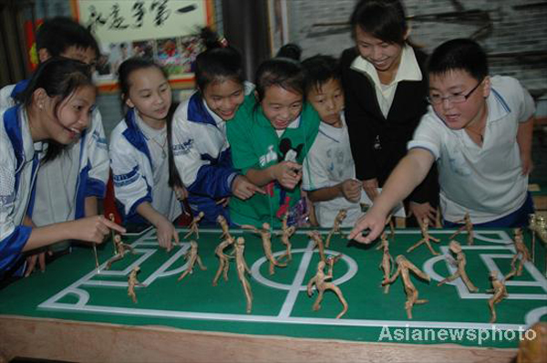 Sports sculptures shown through roots, rocks