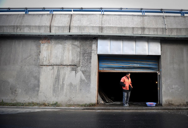 Migrant workers make their home under overpass