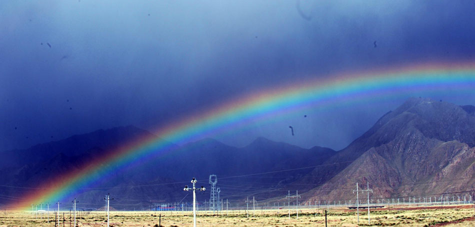 Rainbow appears over desert