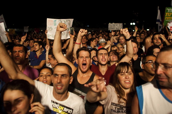 Biggest rally in Israel's history presses PM