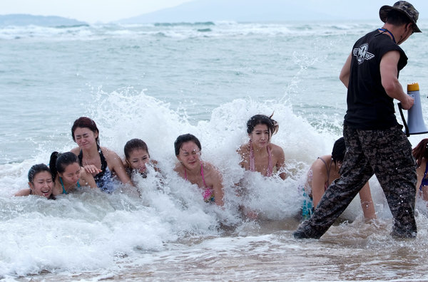 Bodyguard candidates toughen up on the beach