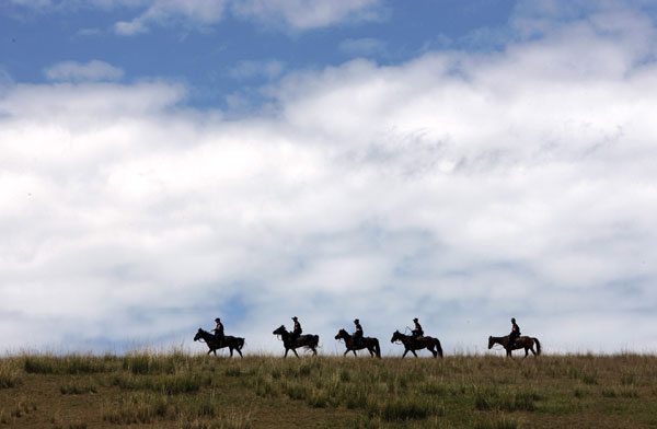 Horse patrol in NW China