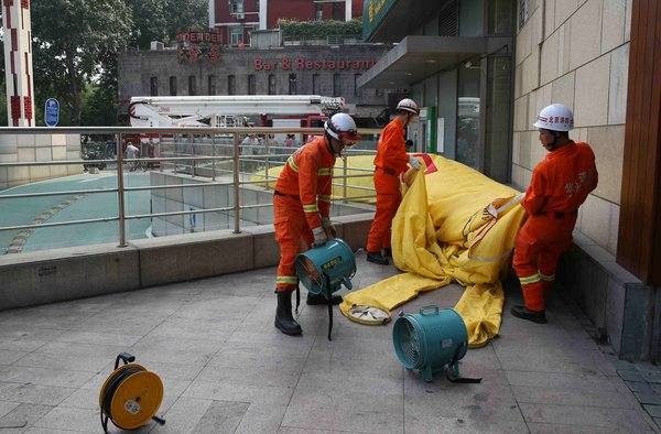 Woman pulled off the ledge in Beijing