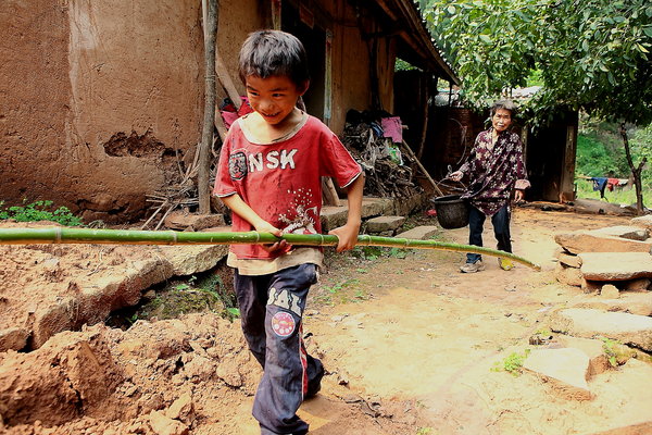 Boy, grandmother, live in isolation in SW China