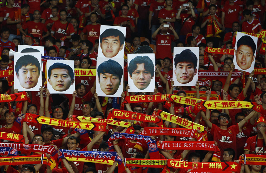 Football fans cheer for Guangzhou Evergrandeu