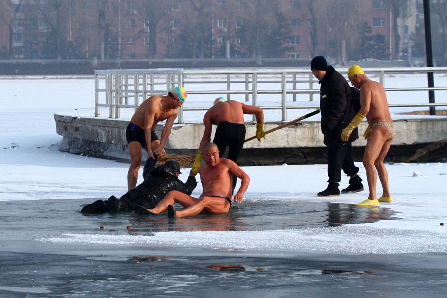 Man saved after falling through frozen lake