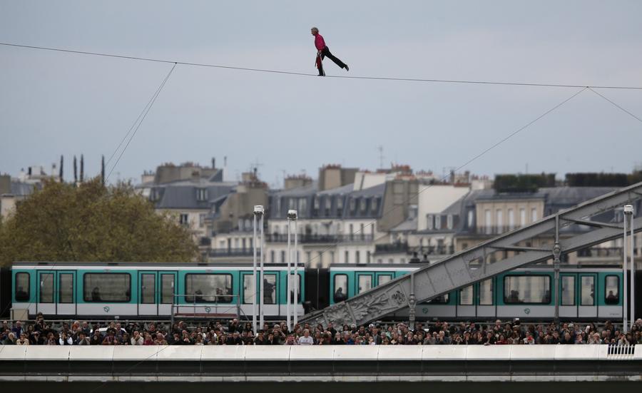 Tightrope walker completes walk over Seine river in Paris