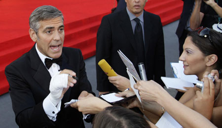 George Clooney and his girlfriend on red carpet at 66th Venice Film Festival