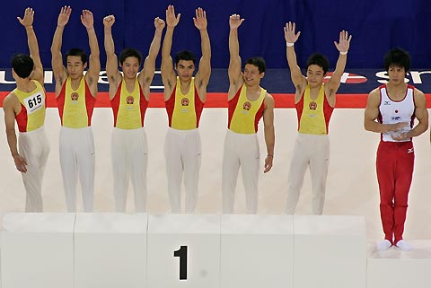 China's Xiao Quin competes on the horizontal bar during the men's team final at the 39th Artistic Gymnastics World Championships in Aarhus, Denmark, October 17, 2006. Team China won the gold medal on Tuesday followed by Russia's silver and Japan's bronze.