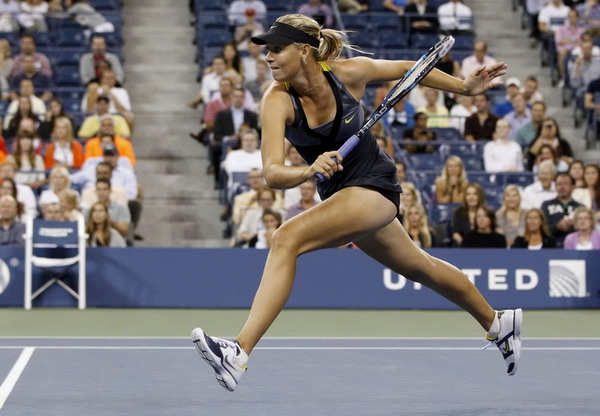 Sharapova shifts up a gear to reach third round