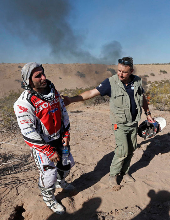 Paulo Goncalves' bike in flames in Dakar Rally