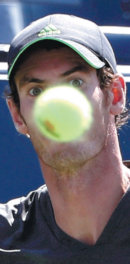 Murray grinds through cramps to win