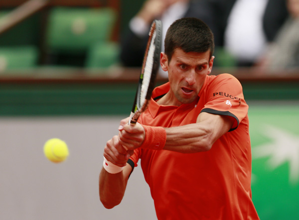 Nadal, Djokovic sail on, Bouchard ousted at Roland Garros