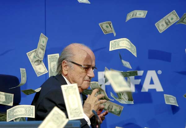 Blatter showered with paper money before unveiling FIFA reform plan