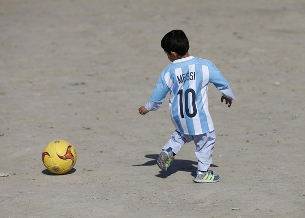 Afghan boy who wore plastic bag 'Messi' shirt gets signed jersey from soccer star