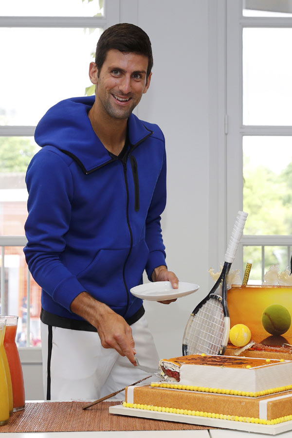 Djokovic marks his birthday at Roland Garros