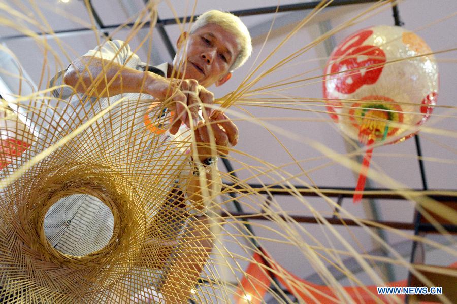 Chinese craftsmen show lanterns for Singapore's Teochew Festival