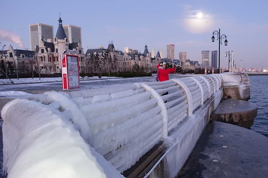 Icicles seen after snowfall on seashore in Dalian