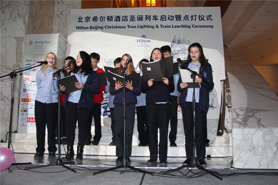 Beijing gets into Christmas spirit with illuminated trees, carols and the smell of cinnamon