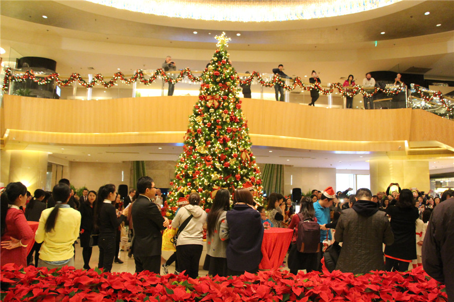 Beijing gets into Christmas spirit with illuminated trees, carols and the smell of cinnamon