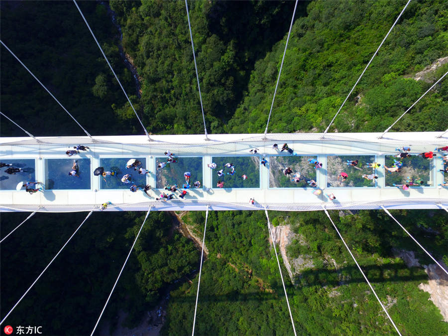 World's longest, highest glass bridge opens in Hunan